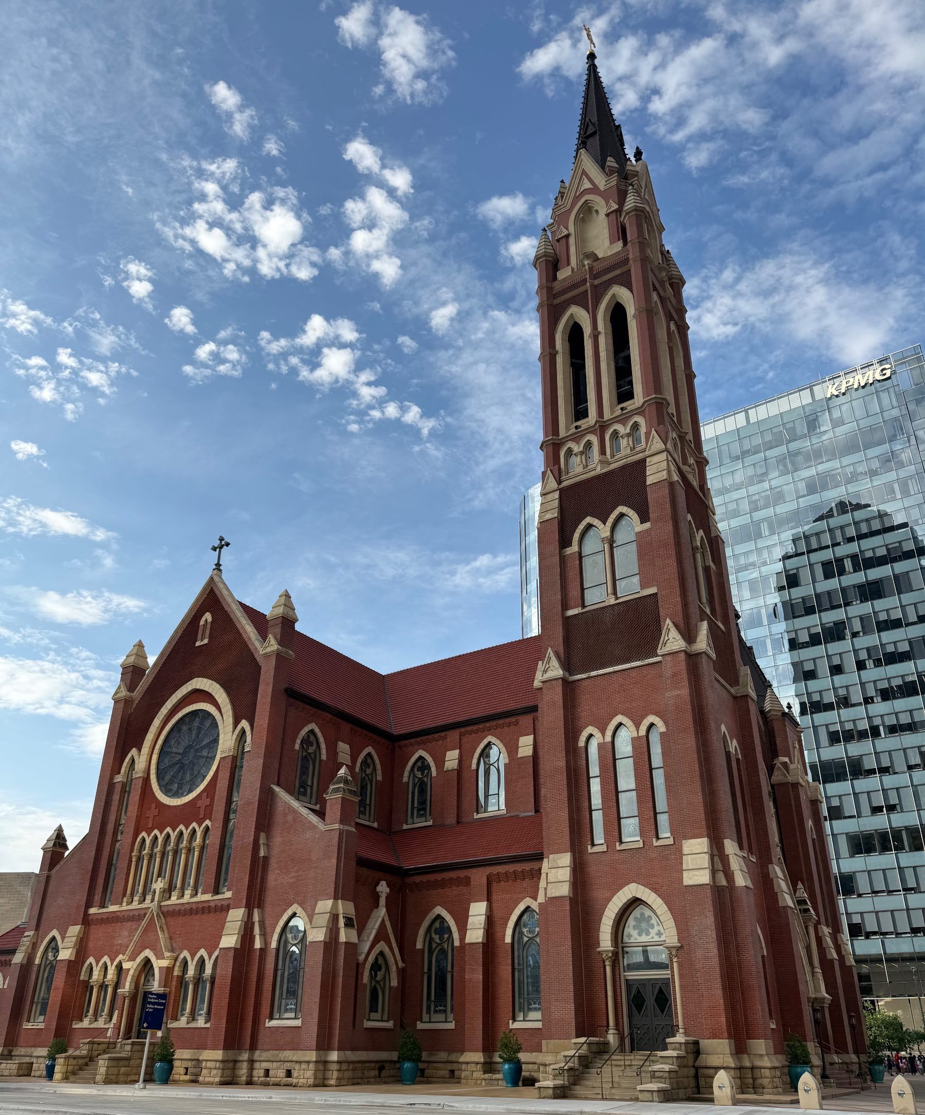 Cathedral Santuario de Guadalupe against the downtown Dallas skyline (KPMG Tower)