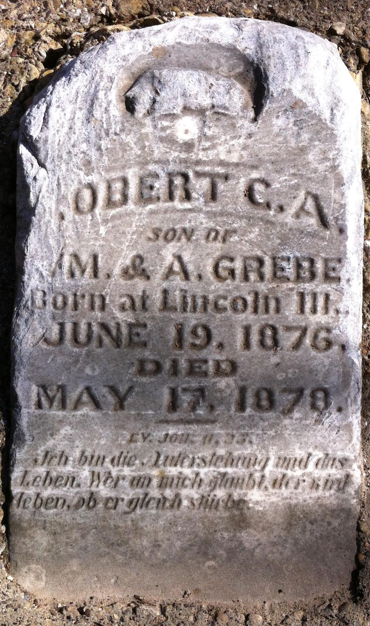 A weathered 1870s headstone in Pioneer Park Cemetery