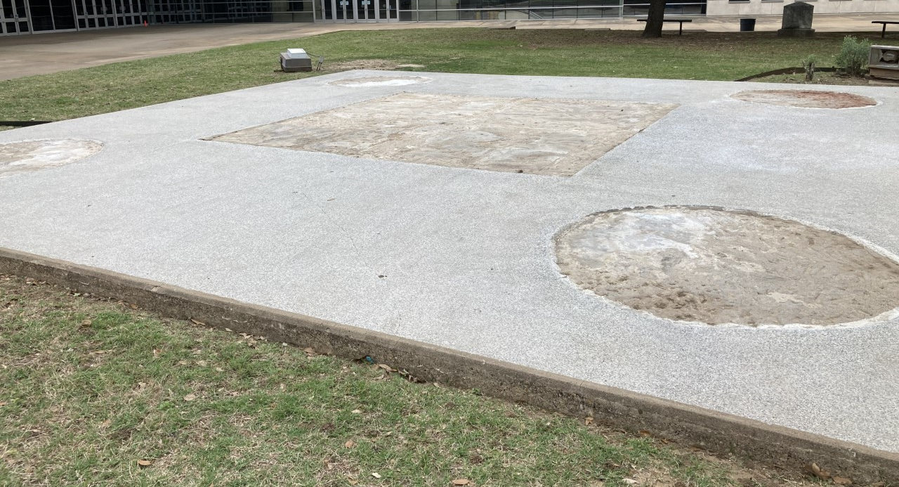 The empty slab in Pioneer Park Cemetery after the 2020 removal of the Confederate War Memorial